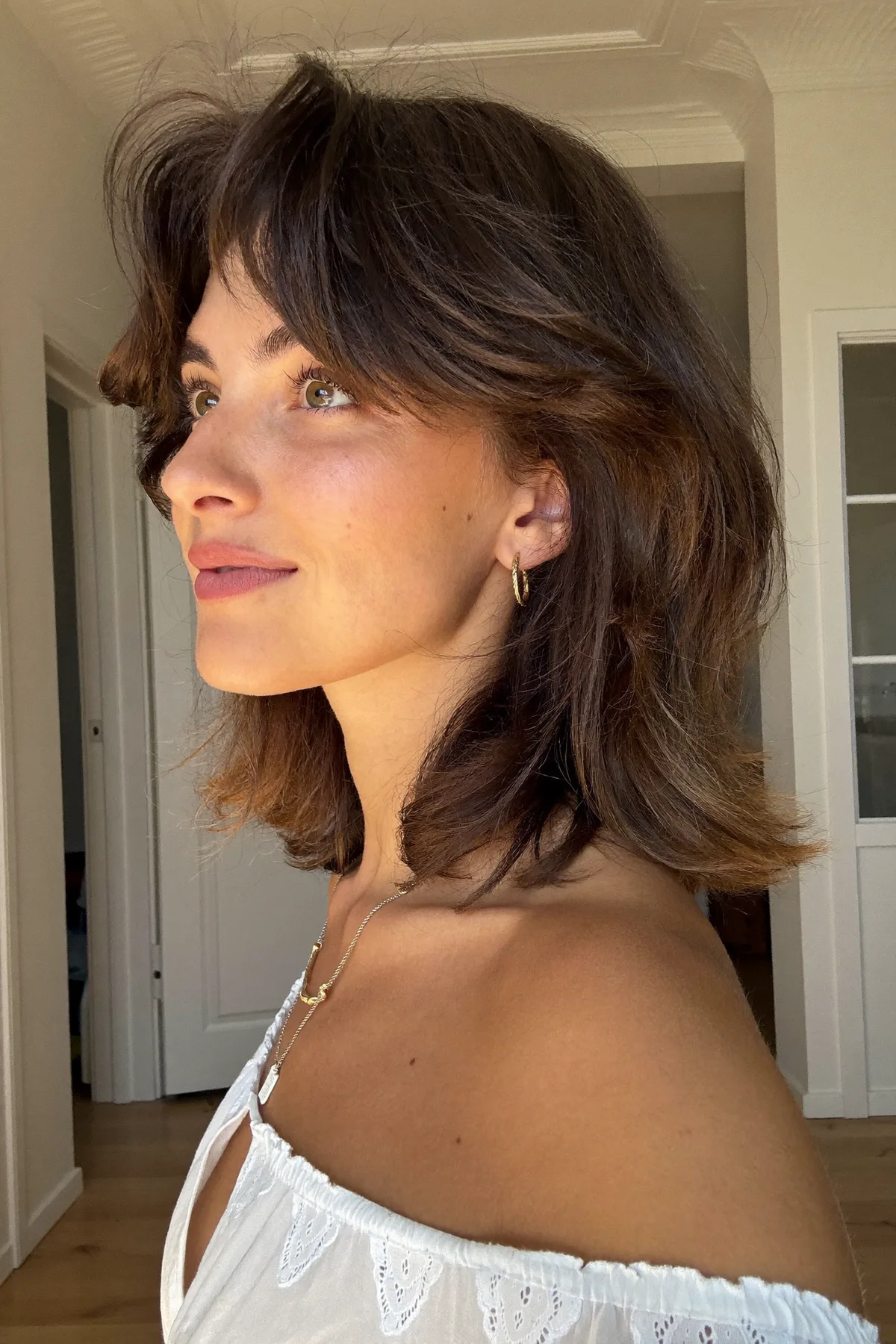 Natural Brunette Shoulder-Length Shag with Curtain Bangs