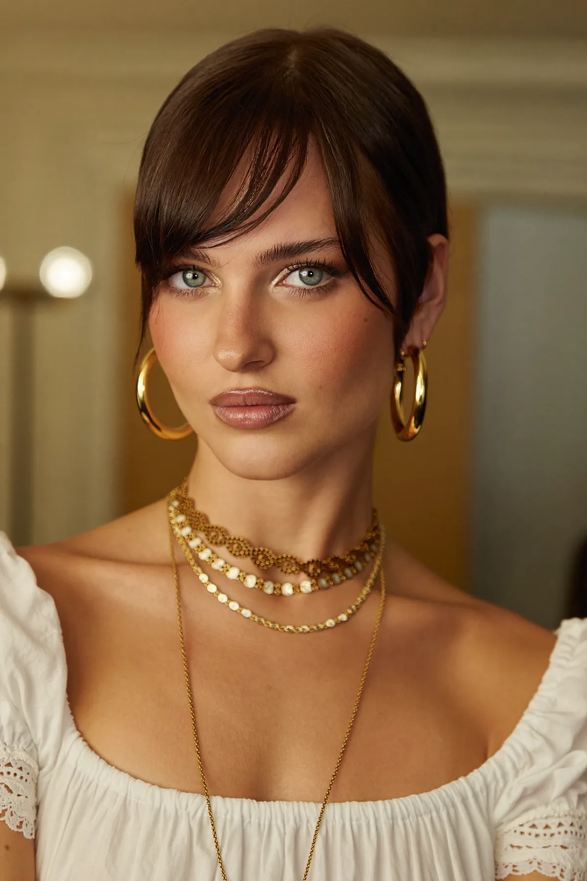 Sleek Straight Natural Brunette Chin-Length Bob With Curtain Bangs