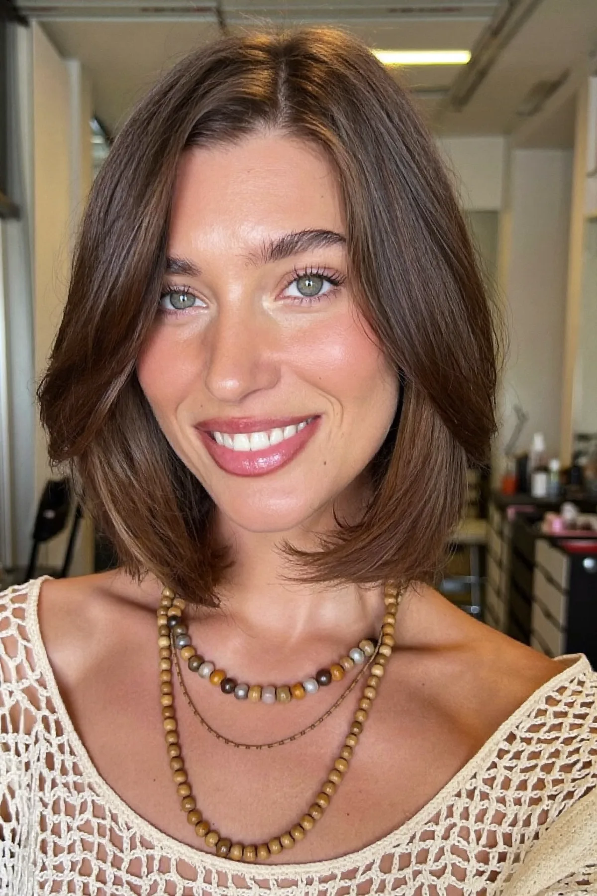 Chin-Length Natural Brunette Bob with Sleek Curtain Bangs