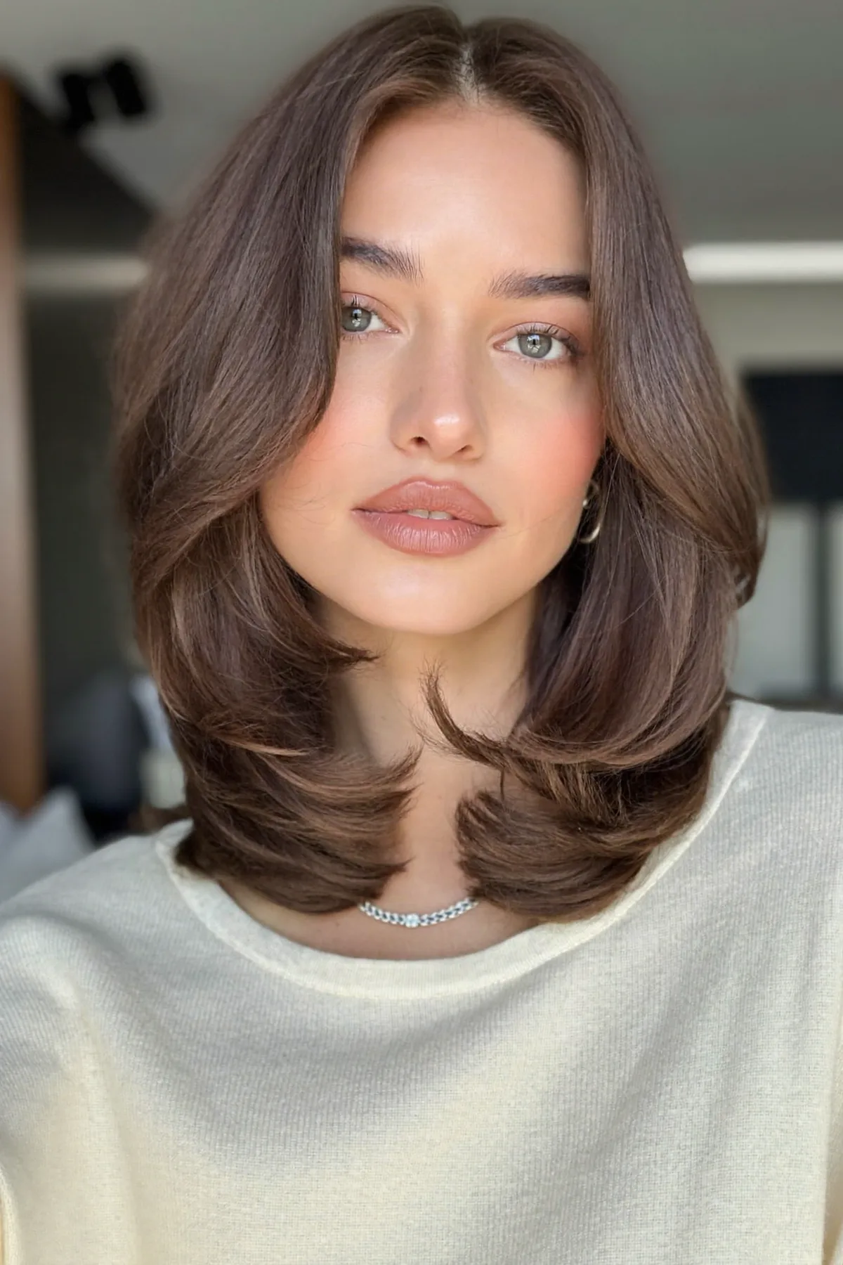 Sleek Natural Brunette Lob with Curtain Bangs and Solid Finish