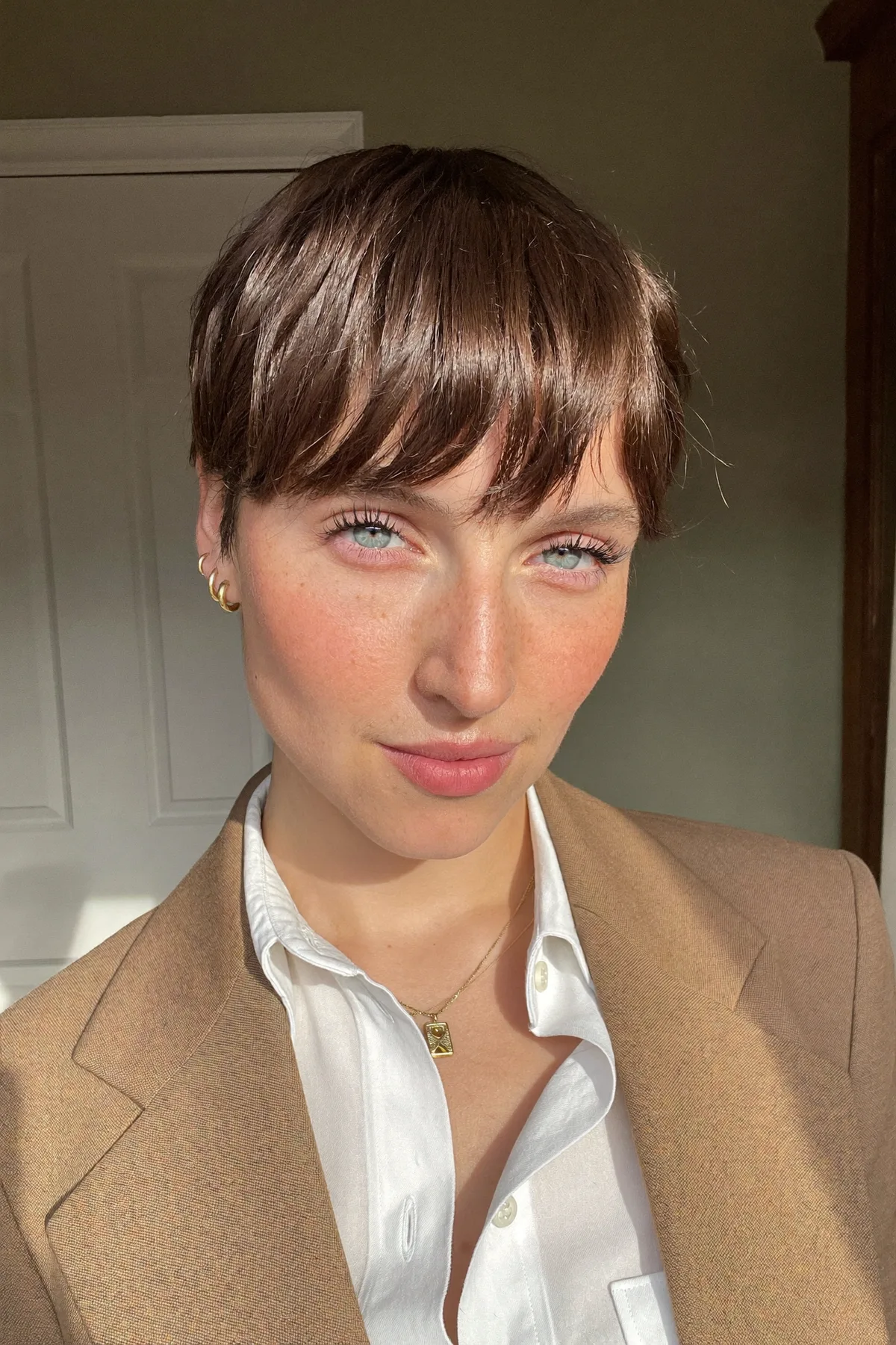 Sleek Straight Natural Brunette Pixie Cut with Full Fringe Bangs