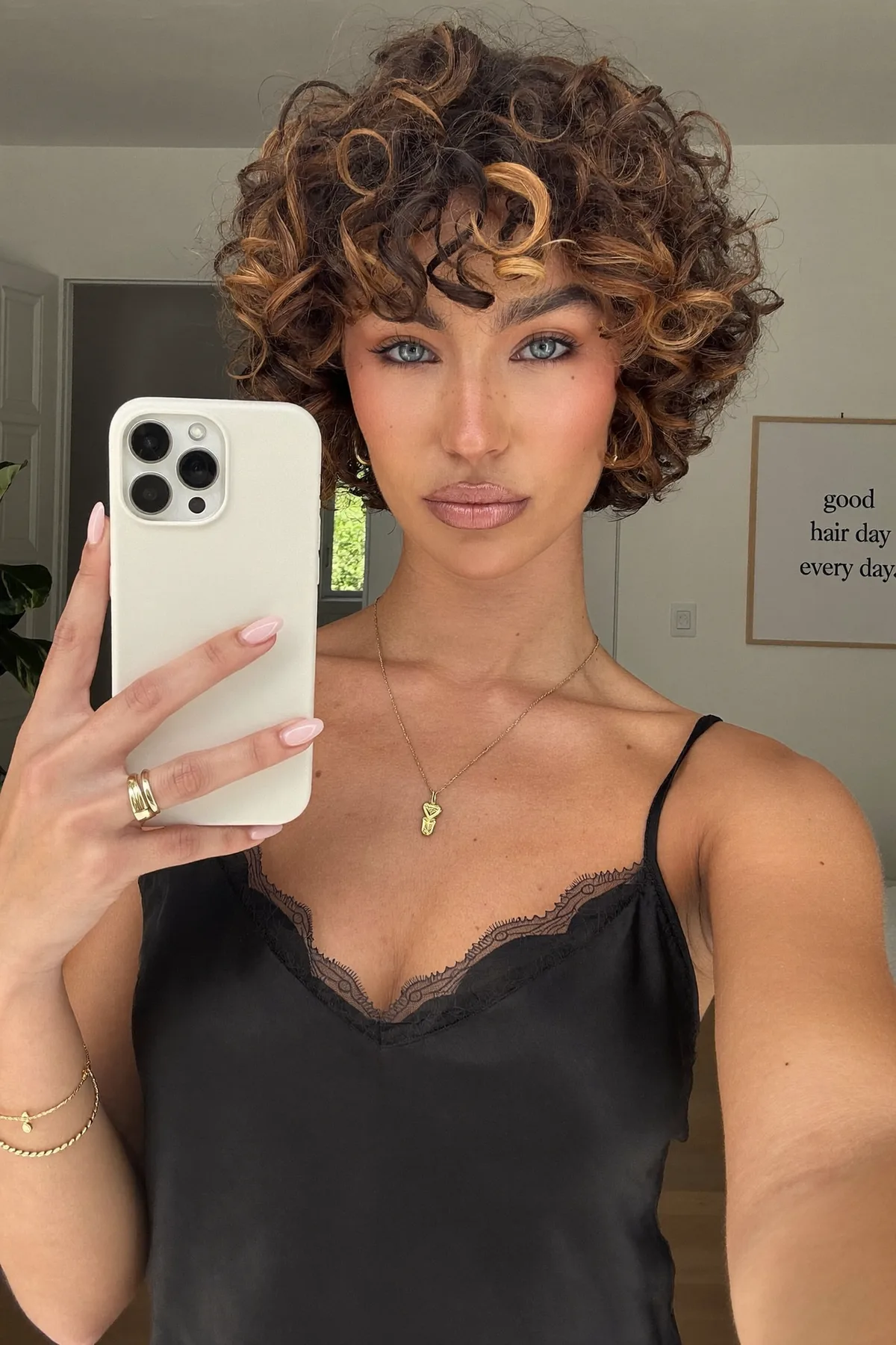 Chin-Length Curly Natural Brunette Bob with Chunky Highlights