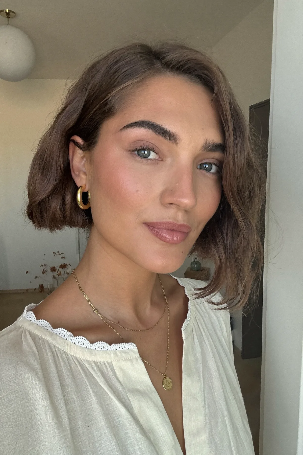 Chin-Length Natural Brunette Wavy Bob for Effortless Elegance