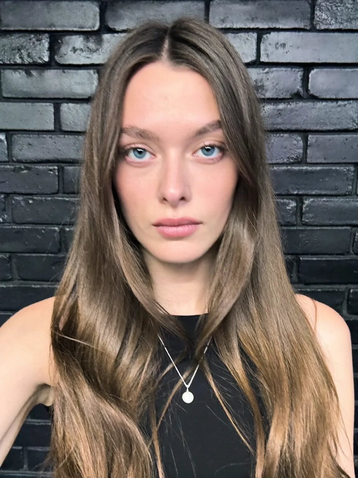 Long Layered Hairstyle with Natural Ash Brown Sheen