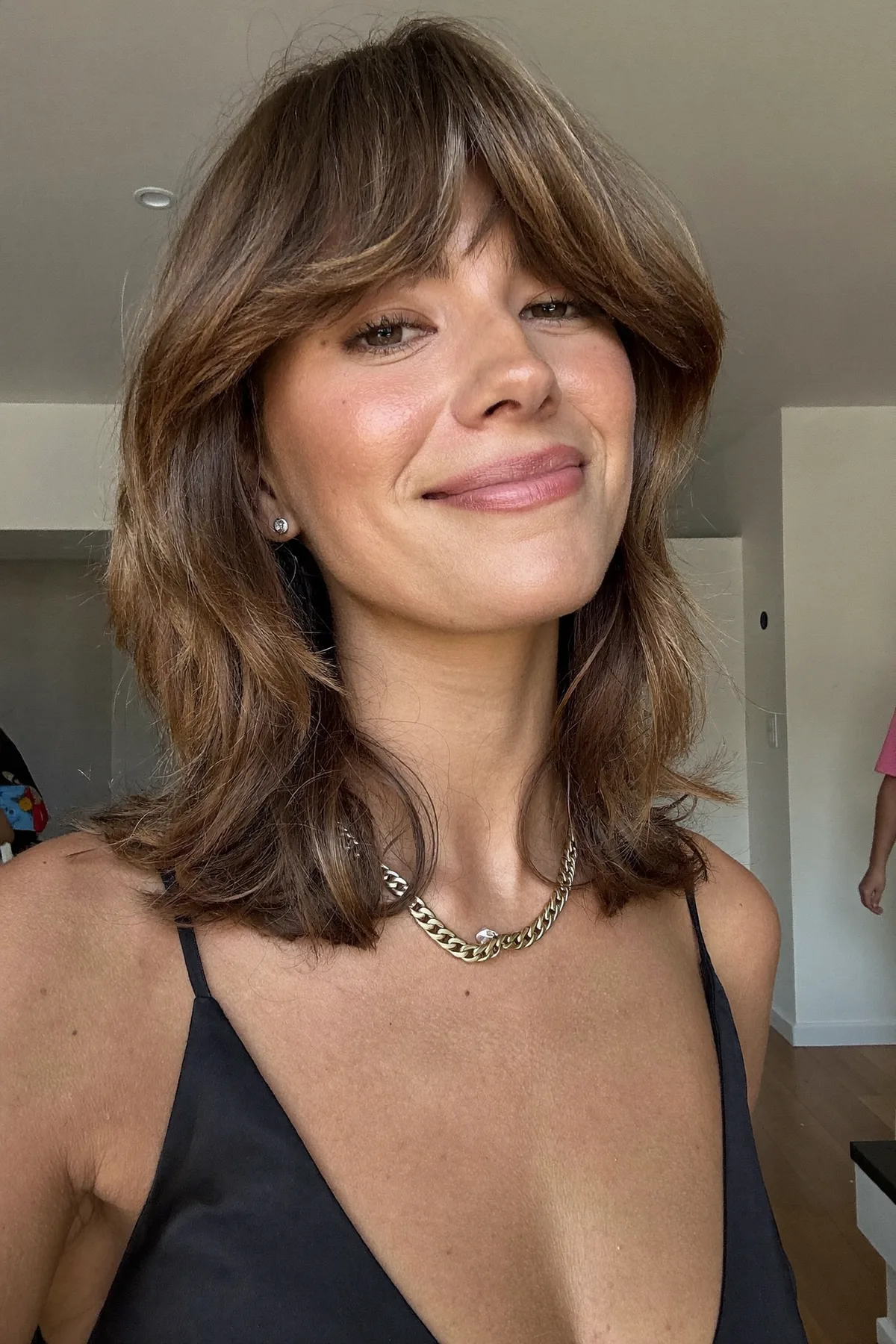Natural Brunette Shoulder-Length Lob with Curtain Bangs and Waves