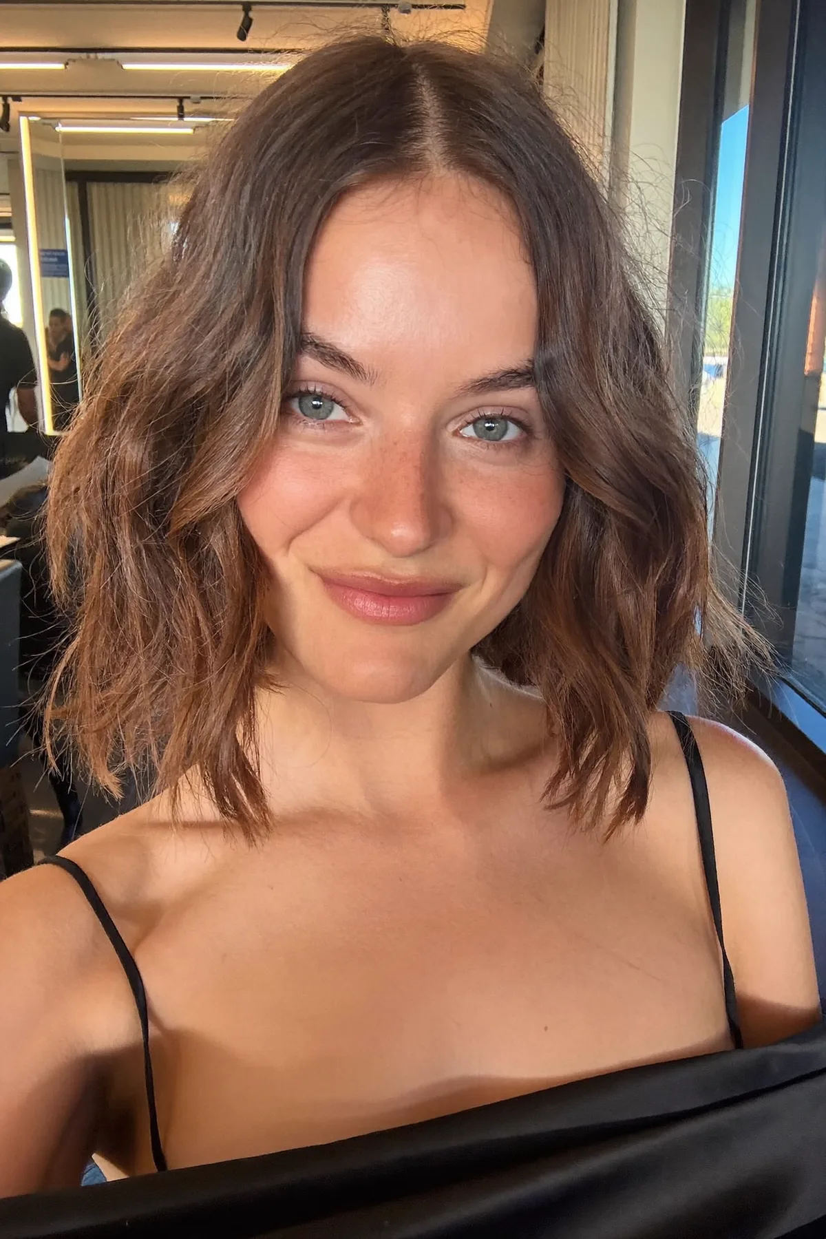 Glossy Natural Brunette Shoulder-Length Lob with Curtain Bangs
