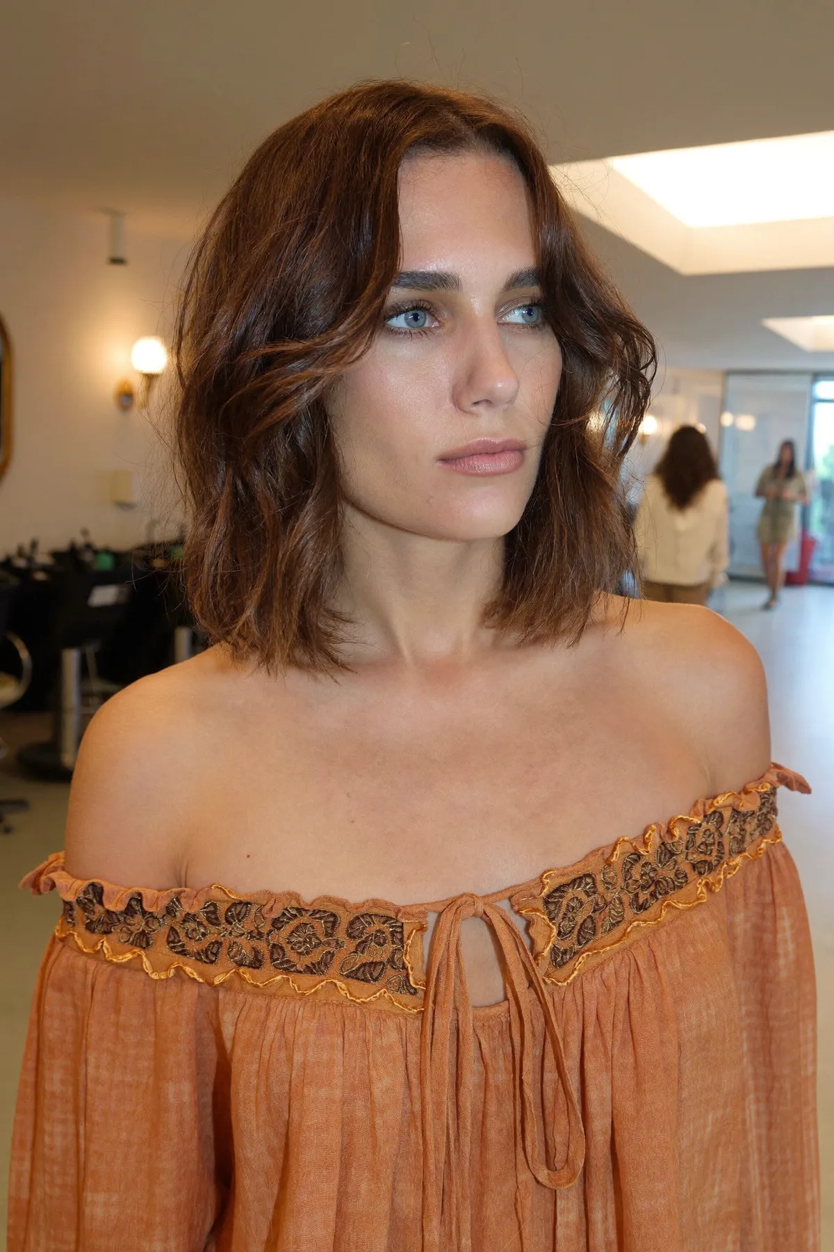 Natural Brunette Wavy Lob with Curtain Bangs and Solid Color