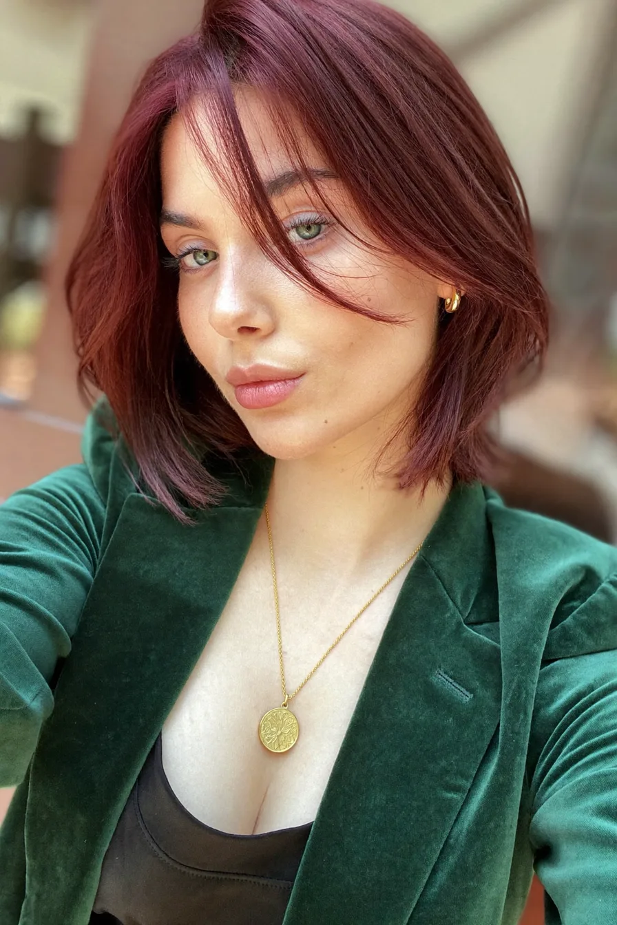 Chic Layered Chin-Length Bob with Burgundy Curtain Bangs
