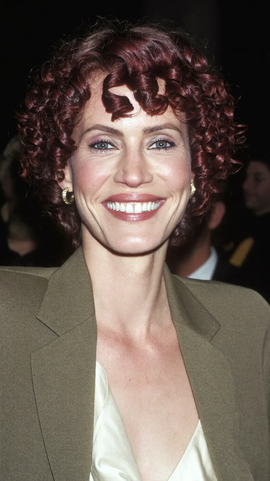 Vibrant High-Volume Curly Bob with Bold Curly Bangs