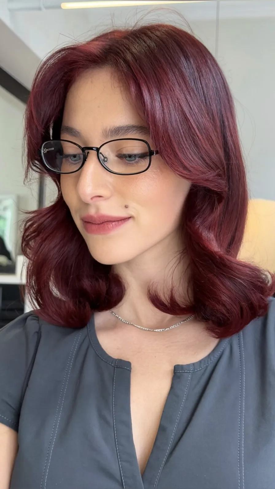 Elegant Deep Burgundy Shoulder-Length Hair with Curtain Bangs
