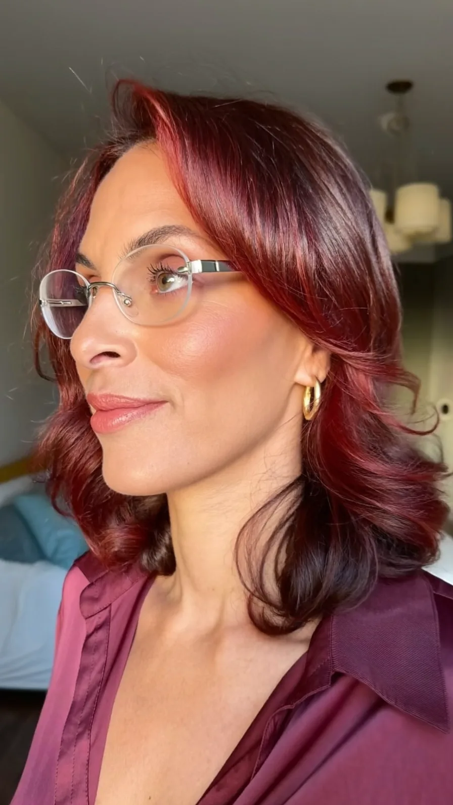 Modern Burgundy Shoulder-Length Layers with Side-Swept Bangs