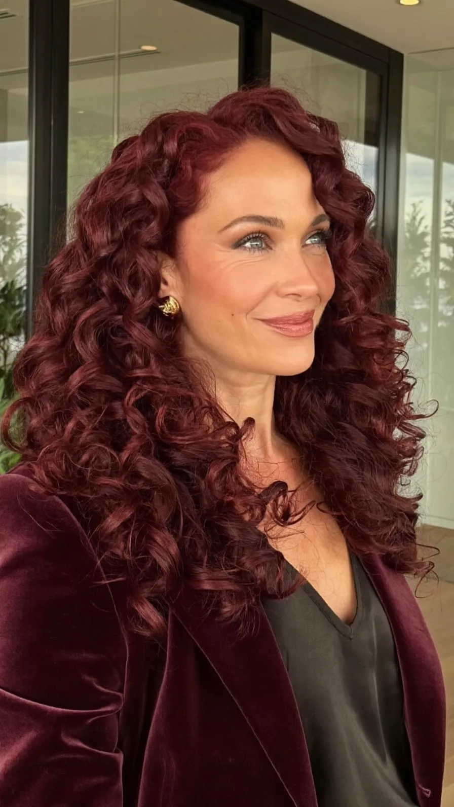 Voluminous Deep Burgundy Red Layered Curly Long Hairstyle