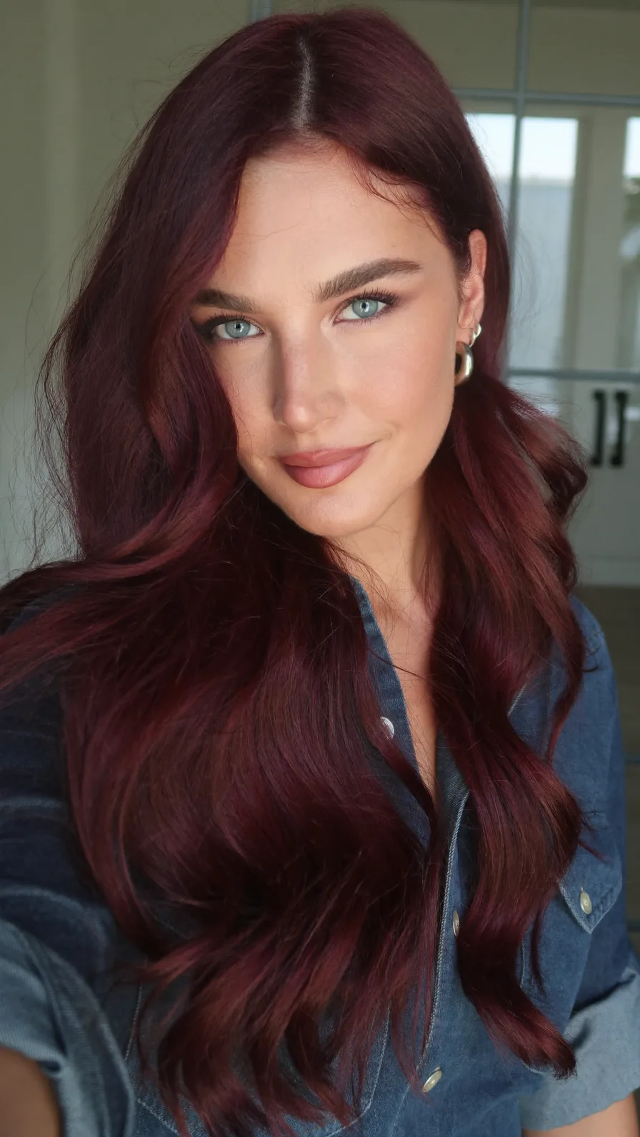 Elegant Long Burgundy Wavy Layers with Side-Swept Bangs