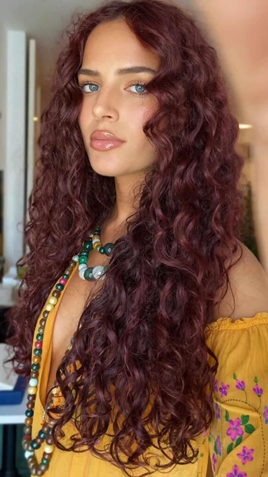 Voluminous Deep Burgundy Long Curly Layers with Natural Movement