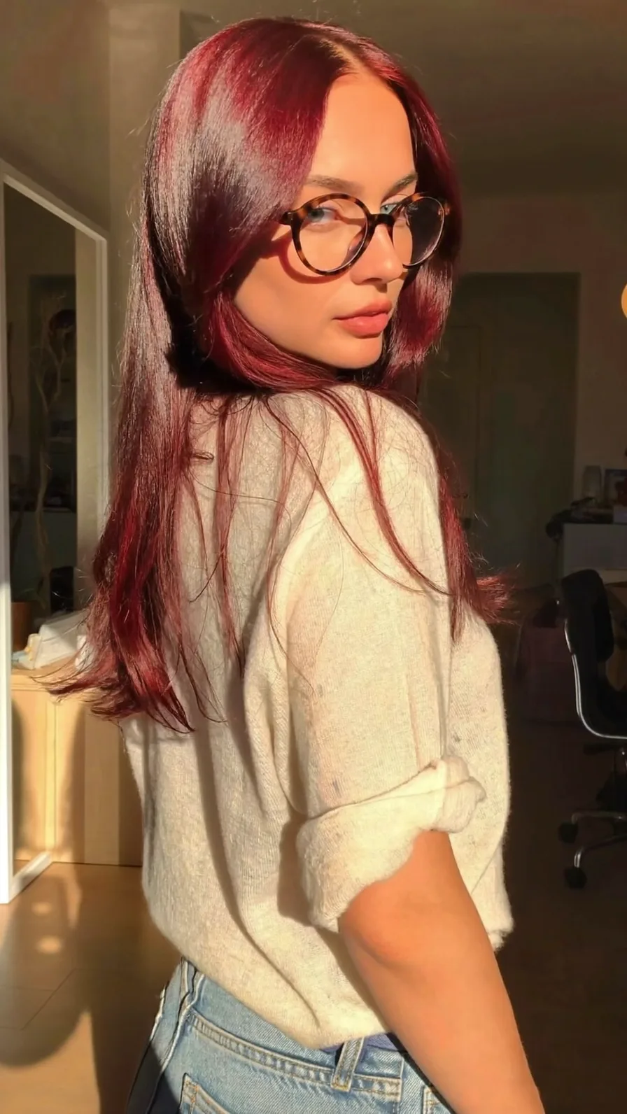 Sleek Long Layered Burgundy Hair with Center-Parted Bangs