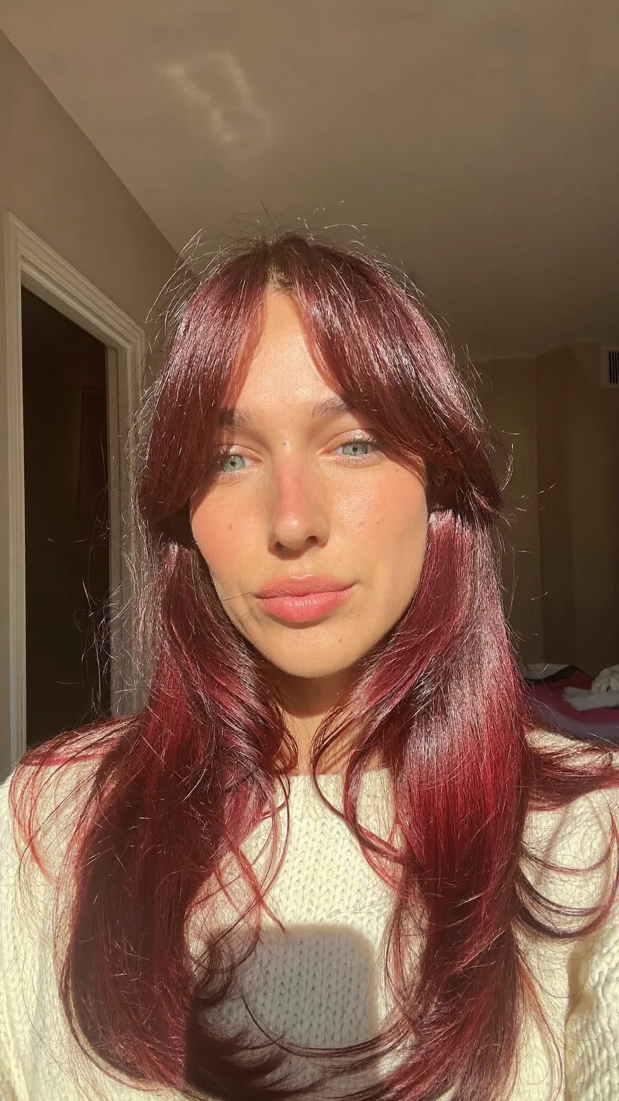 Long Layered Burgundy Hair with Soft Curtain Bangs