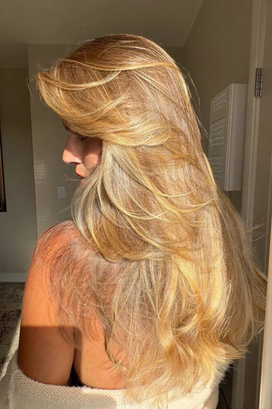 Glamorous Layered Blowout with Sun-Kissed Butter Blonde Shine