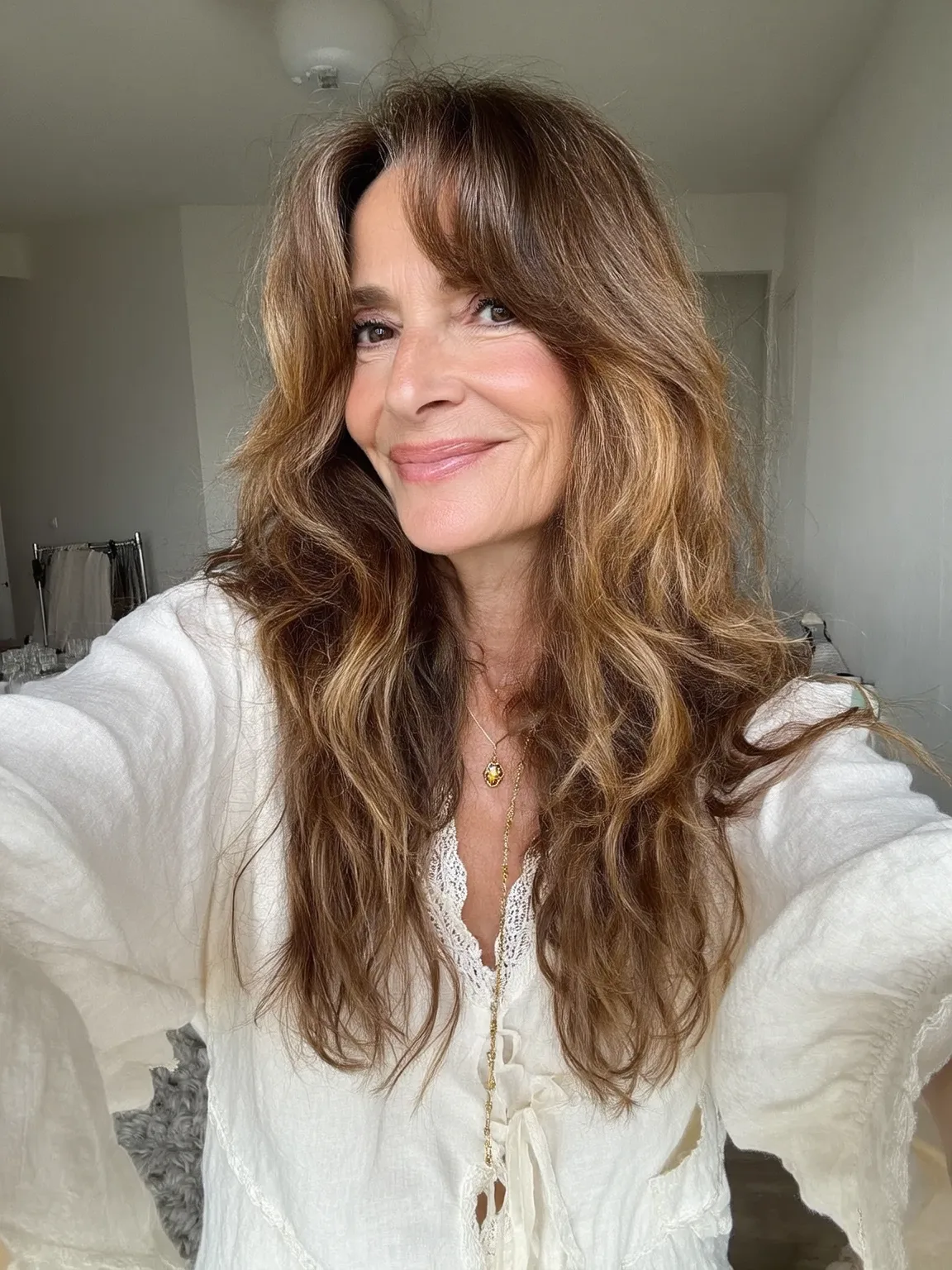Long Layered Waves with Sun-Kissed Balayage Highlights