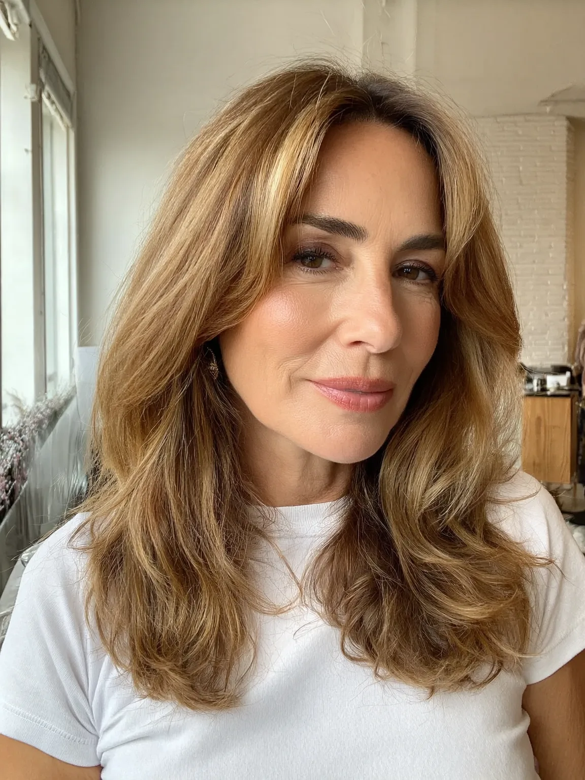 Long Layers with Honey Blonde Balayage and Curtain Bangs