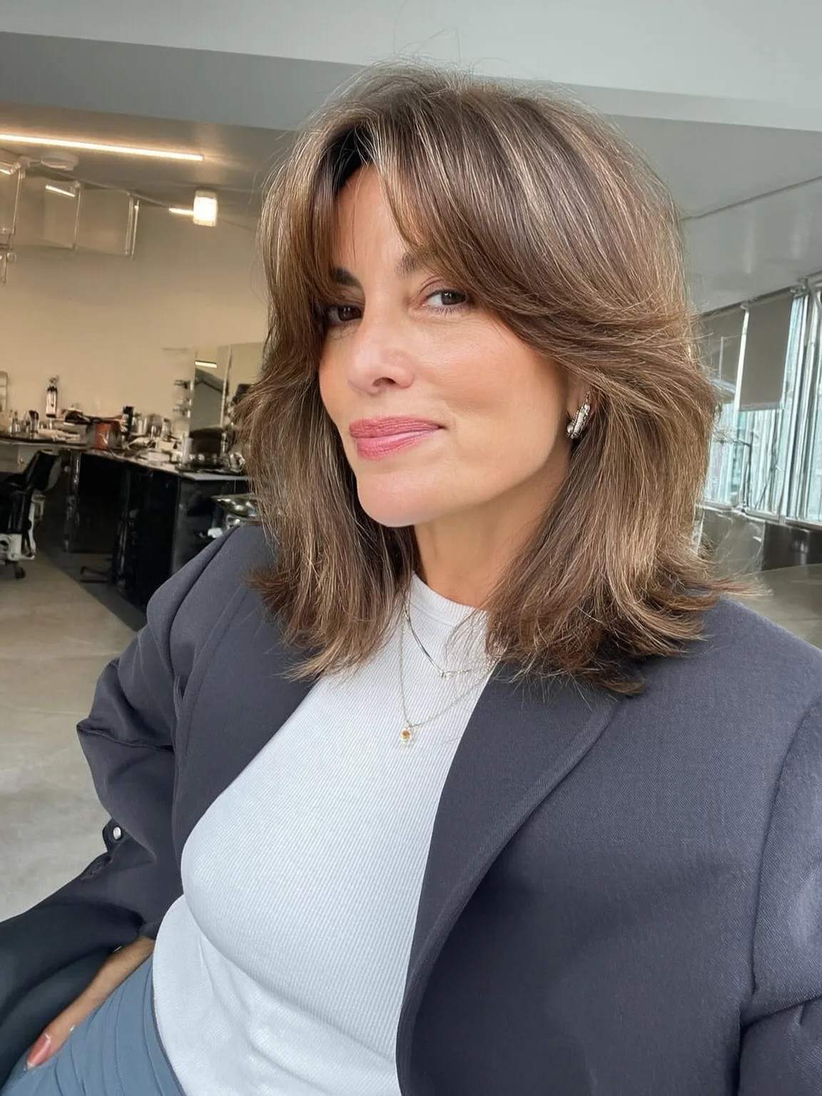 Warm Caramel Brown Wavy Layers with Curtain Bangs