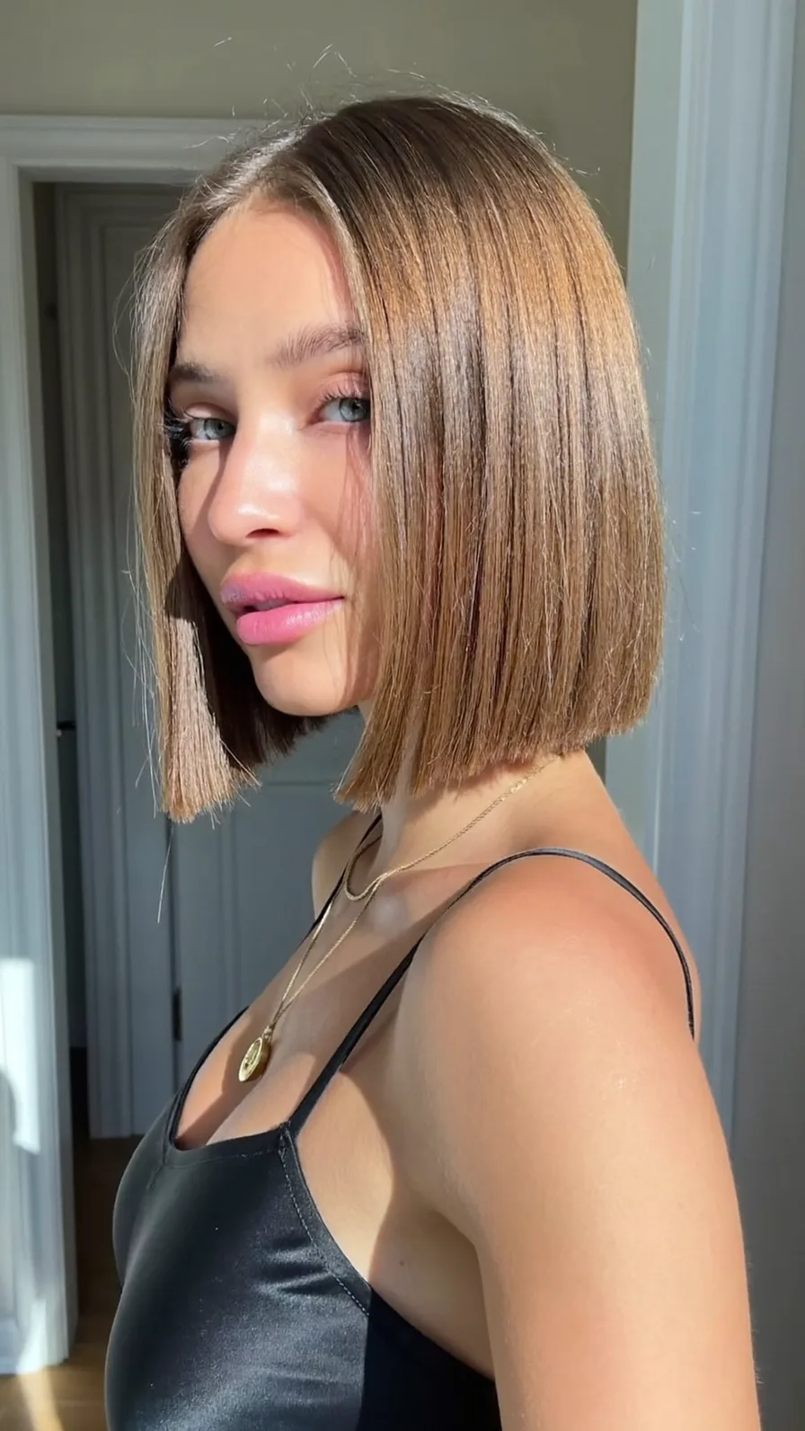 Sleek Warm Caramel Brown Blunt Bob with Curtain Bangs