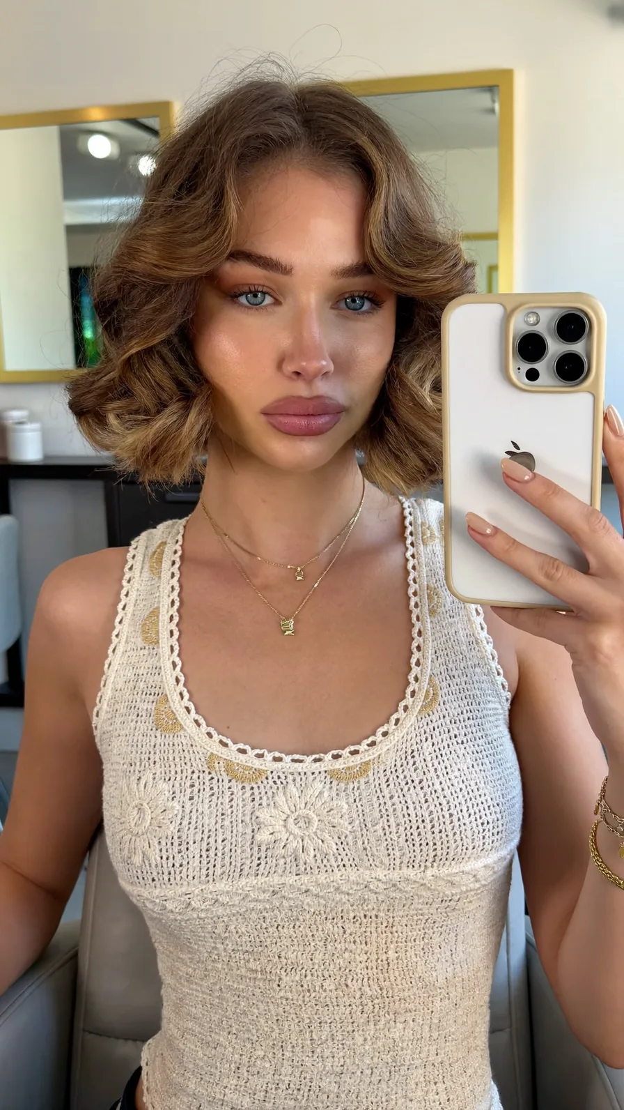 Chic Chin-Length Wavy Bob with Curtain Bangs and Highlights