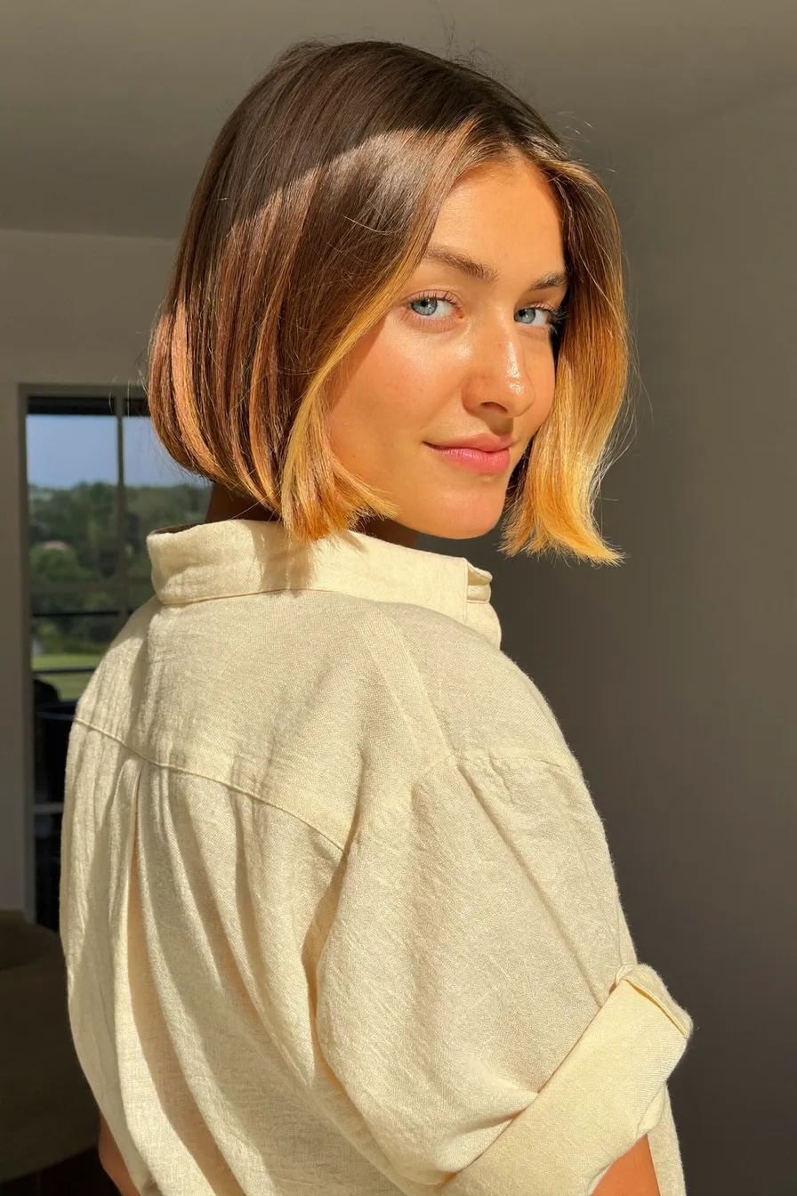 Chic Chin-Length Bob with Balayage and Curtain Bangs