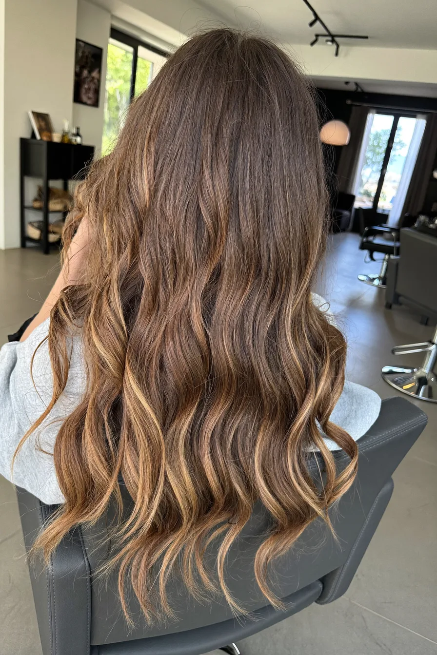 Long Layered Waves with Caramel Brown Highlights for Dimension