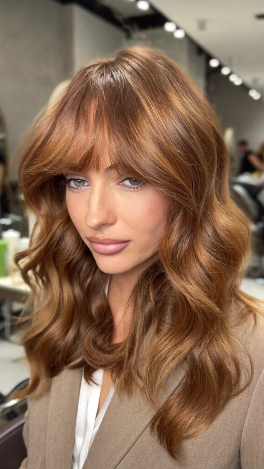 Warm Caramel Brown Long Layers with Flowing Curtain Bangs