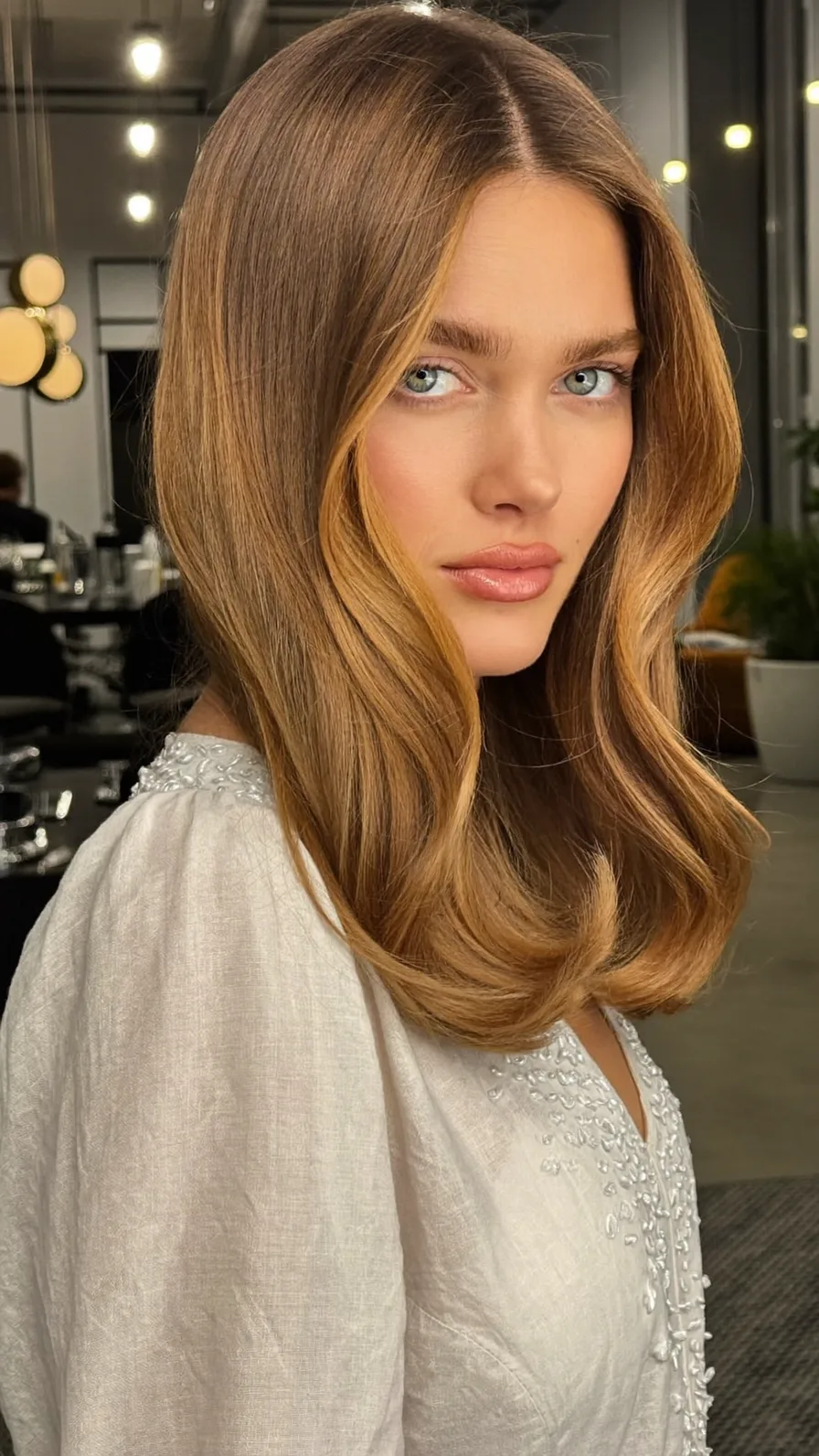 Soft Caramel Brown Long Layers with Flowing Curtain Bangs