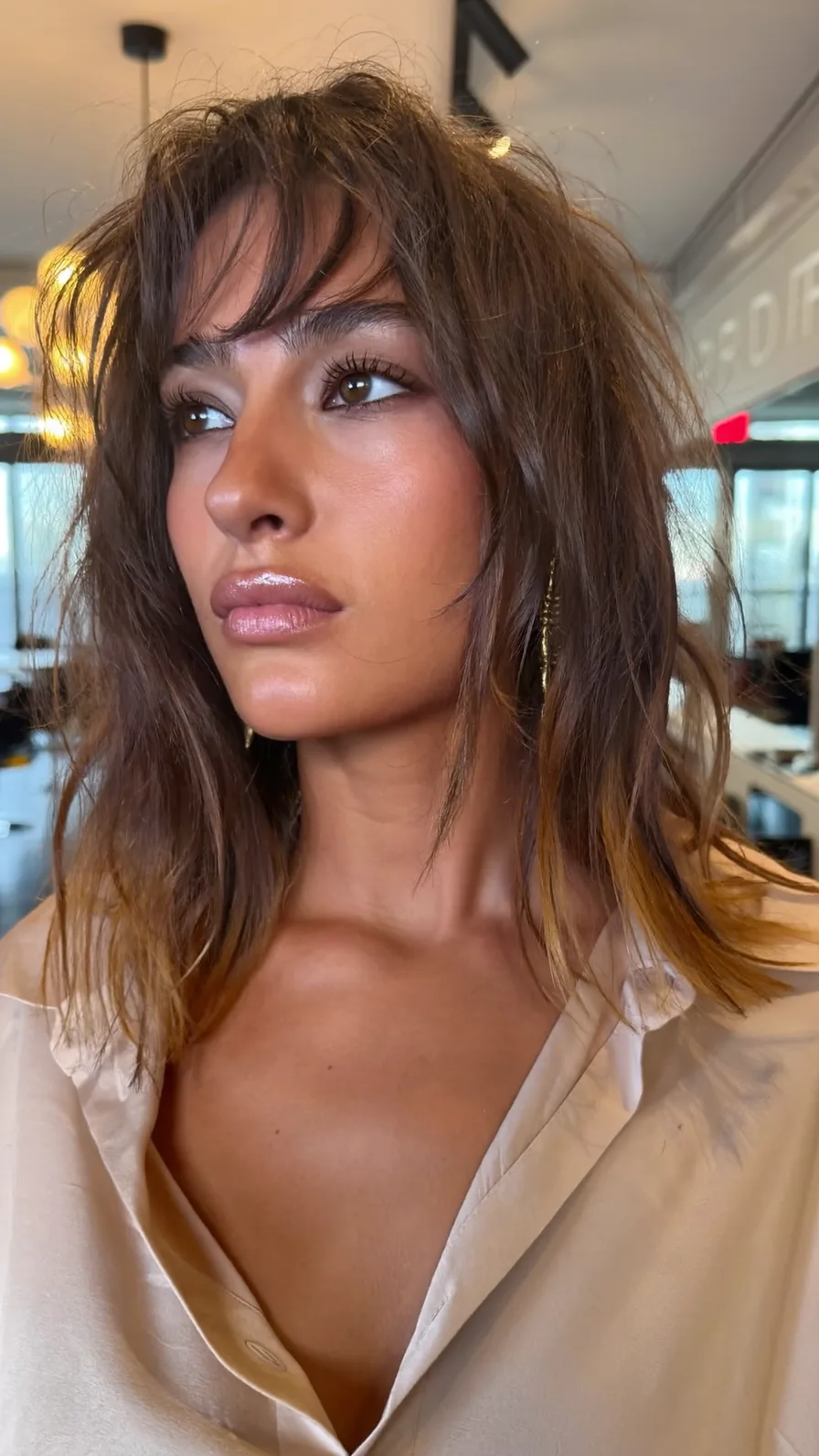 Textured Shoulder-Length Shag with Curtain Bangs and Balayage