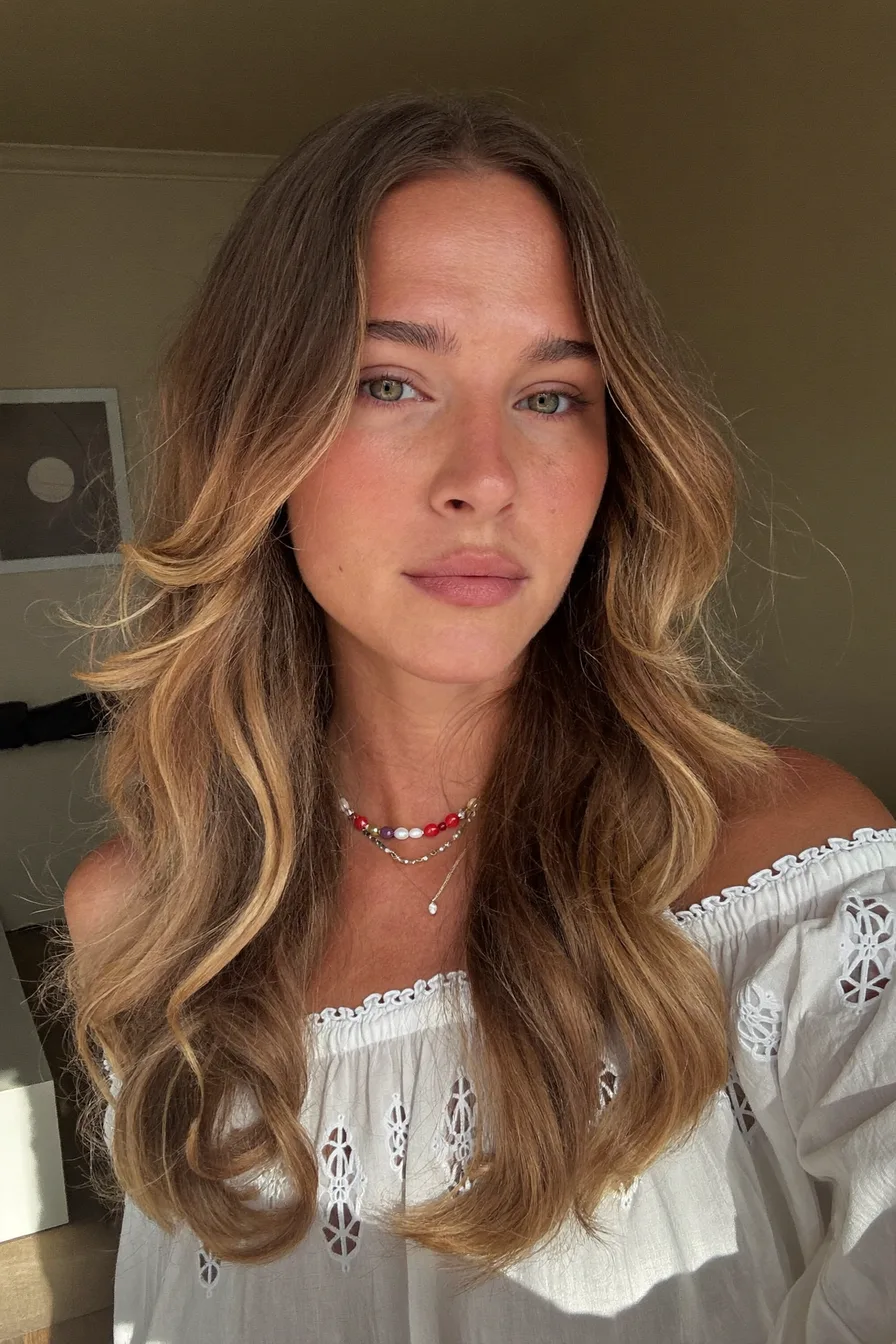 Flowing Long Layered Hair with Warm Balayage Highlights