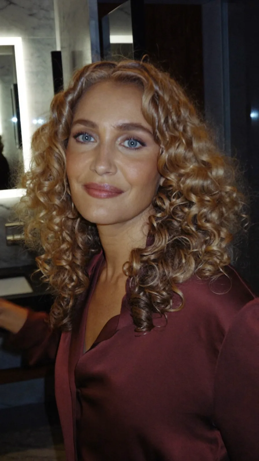 Voluminous Long Curly Layers with Warm Caramel Balayage