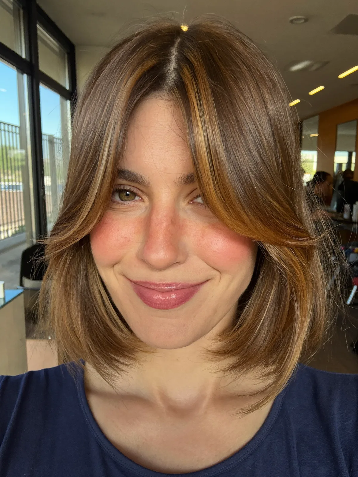 Golden Caramel Bob with Soft Curtain Bangs and Subtle Layers