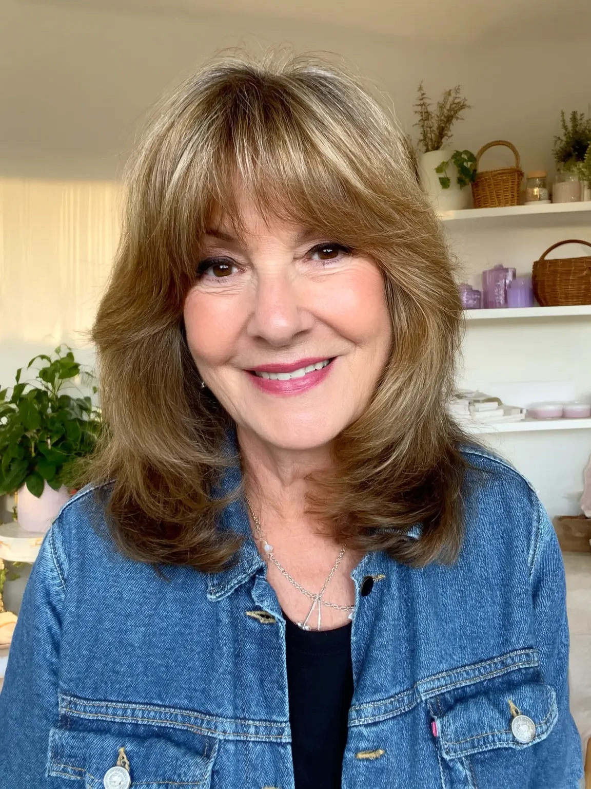 Medium-Length Wavy Layers with Side-Swept Bangs