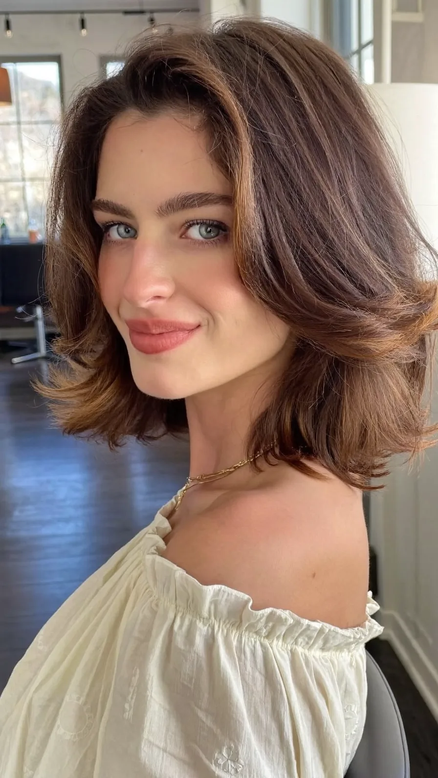 Chic Voluminous Layered Bob with Flicked Ends and Balayage