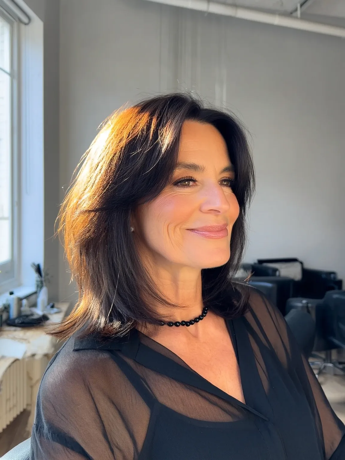 Shoulder-Length Straight Layers with Side Swept Bangs