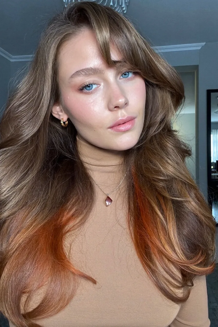 Voluminous Long Layers with Chestnut Brown and Copper Accents