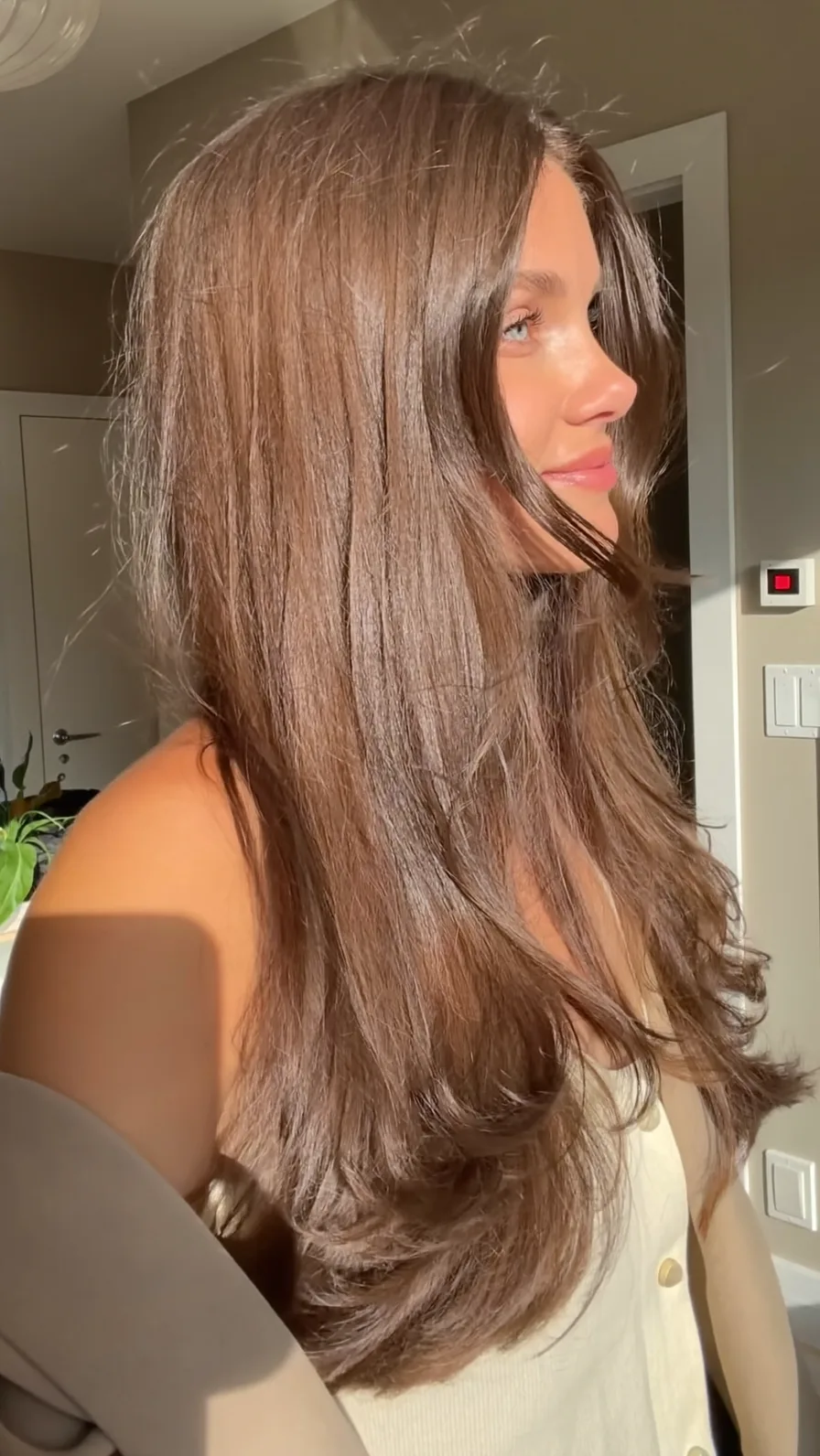 Elegant Long Layers with Curtain Bangs for Soft Movement