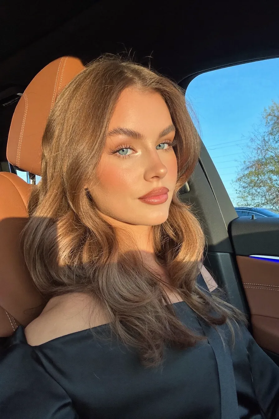 Soft Shoulder-Length Warm Chestnut Brown Waves with Curtain Bangs
