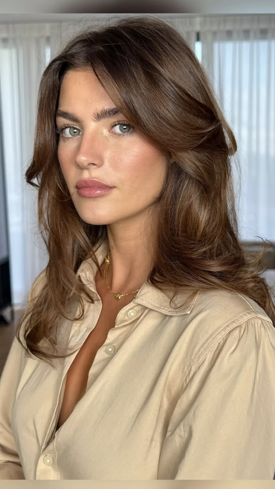 Voluminous Long Layers with Flowing Curtain Bangs Style