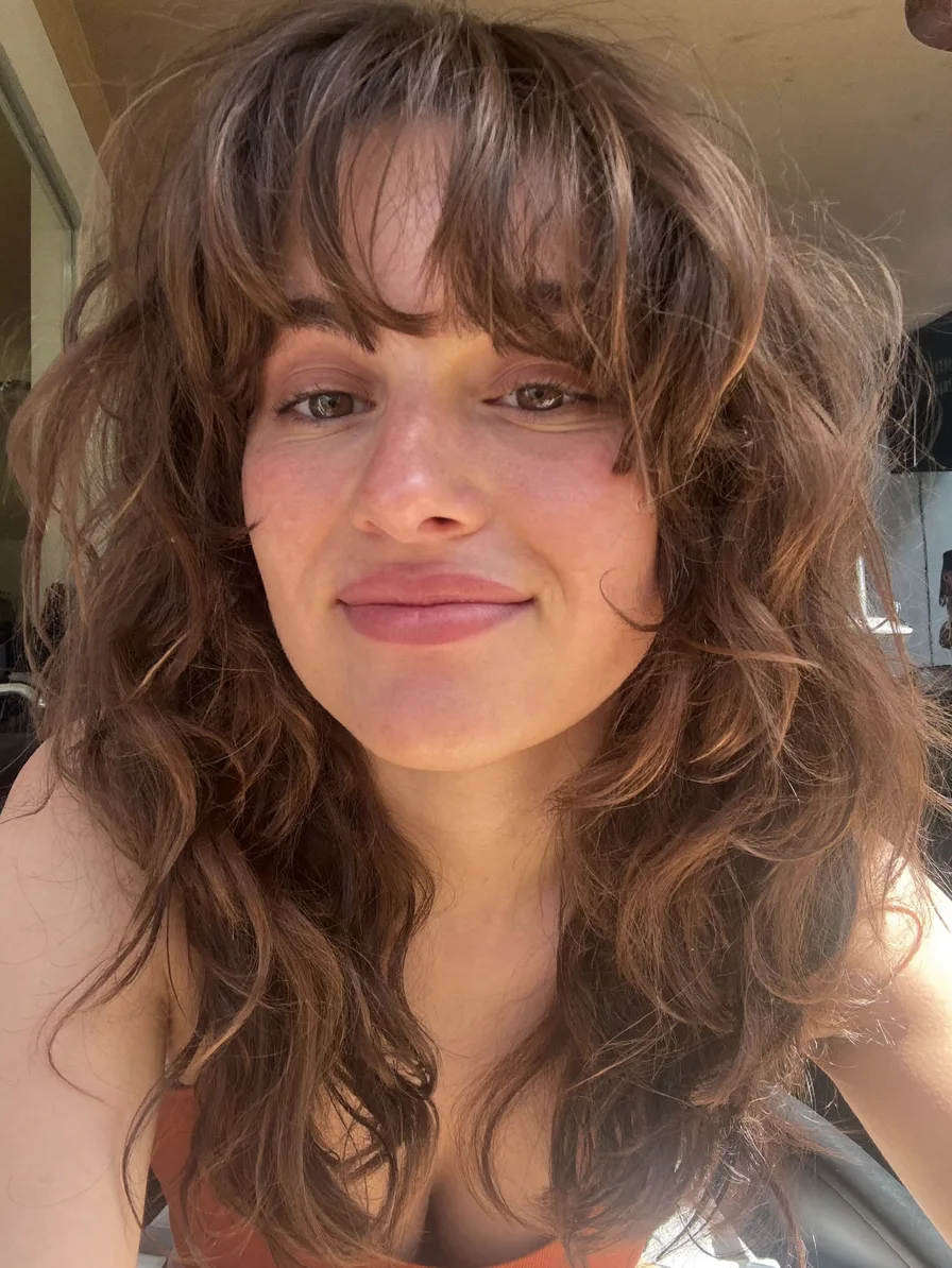Voluminous Textured Long Layers with Soft Curtain Bangs