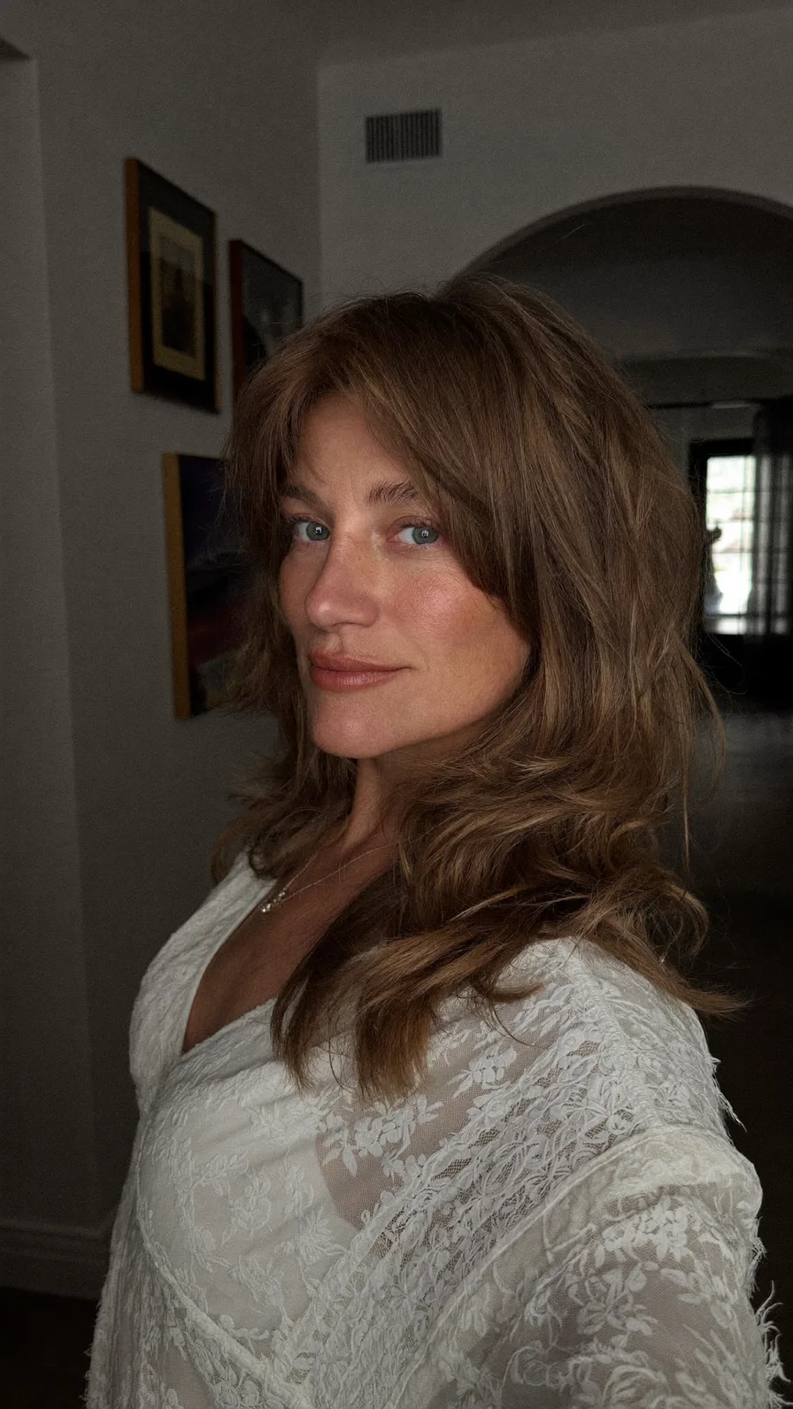 Voluminous Wavy Long Layers With Soft Curtain Bangs