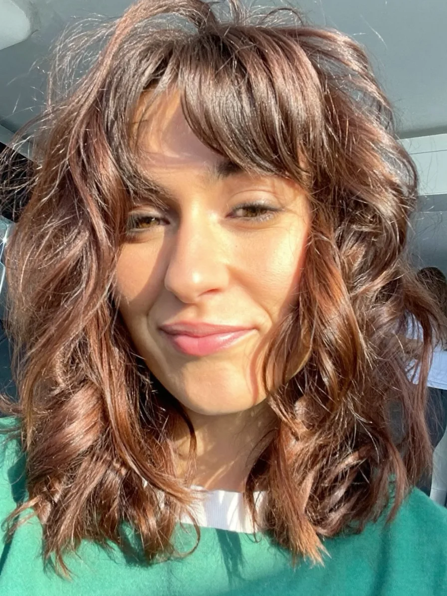 Voluminous Textured Lob with Curtain Bangs for Oval Faces