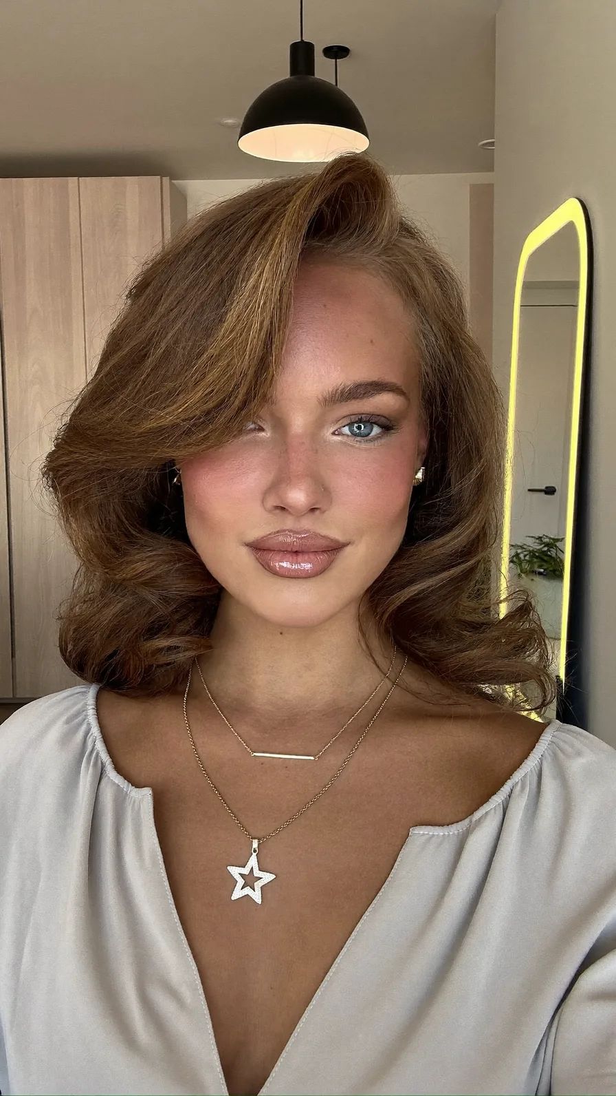 Voluminous Medium Lob with Soft Side-Swept Curls and Layers