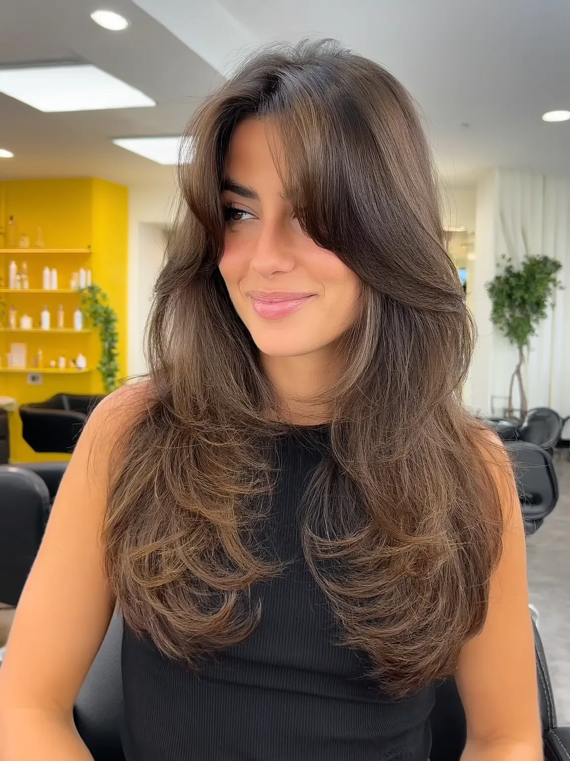 Long Layered Cut with Bouncy Curtain Bangs in Chestnut Brown