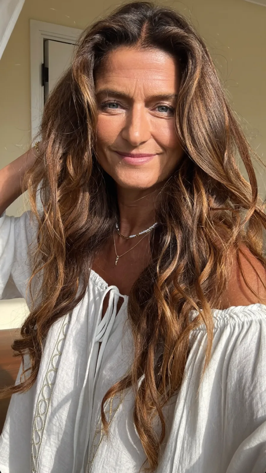 Voluminous Warm Chestnut Brown Wavy Long Layers Hairstyle