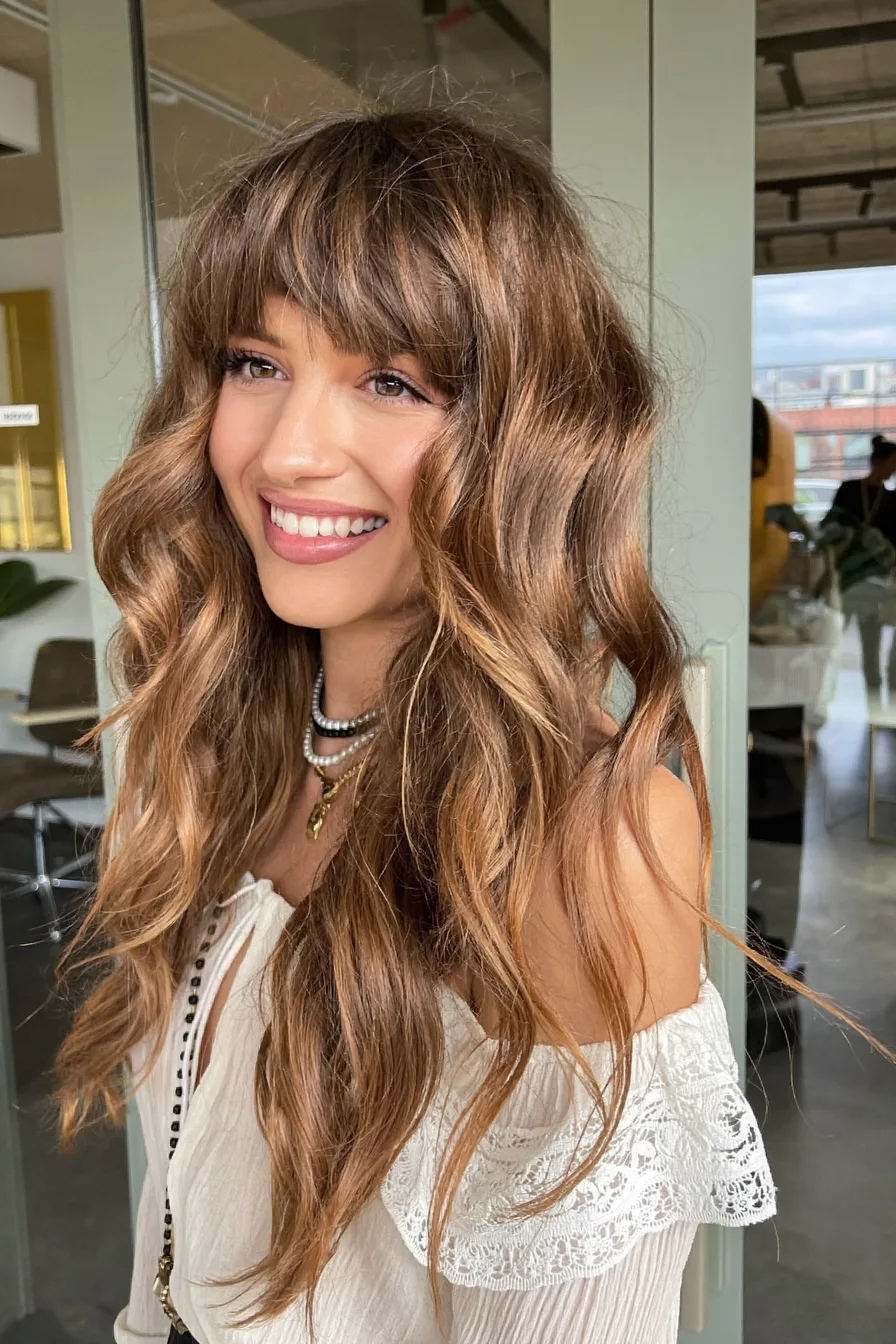 Modern Long Wavy Layers with Balayage and Curtain Bangs