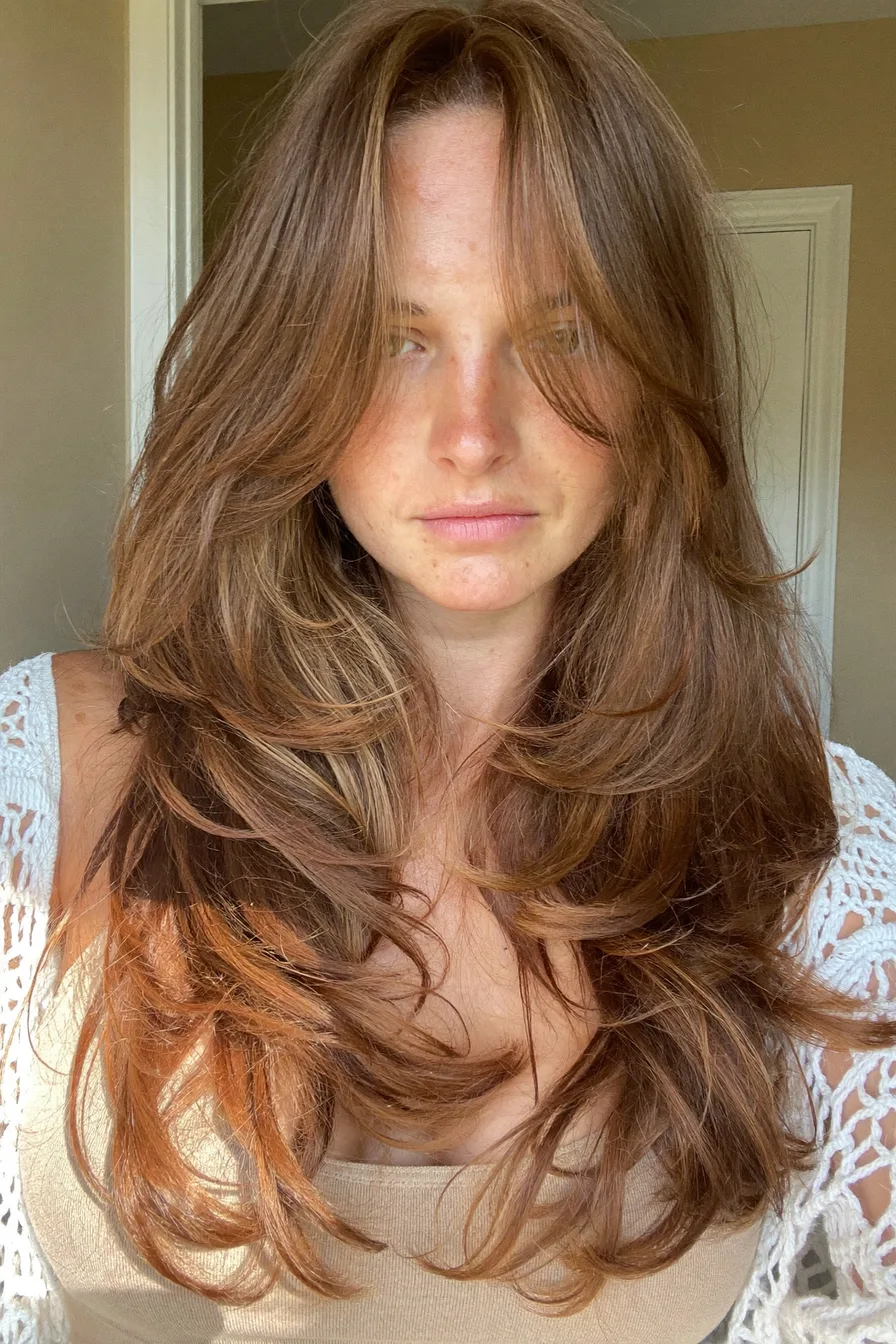 Voluminous Long Layered Hair with Face-Framing Curtain Bangs