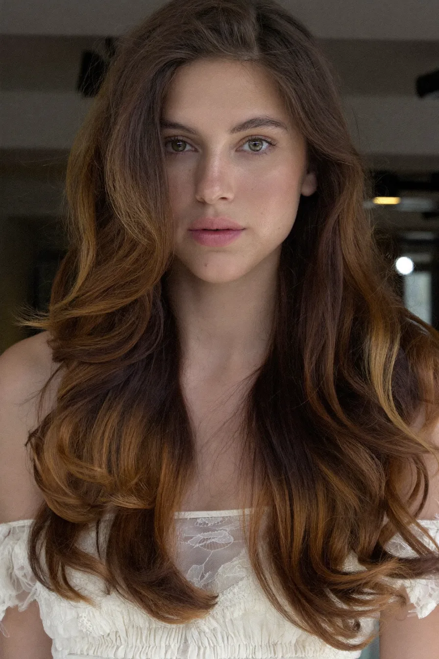 Voluminous Long Layered Waves with Warm Caramel Balayage Highlights
